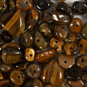 Kristallen kralen met tijgeroogmotief, bruin, 7-12 mm - 63 stuks. Kristallen kralen met tijgeroogmotief, bruin, 7-12 mm - 63 stuks.